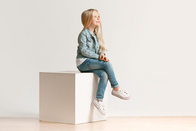 cropped-full-length-portrait-cute-little-kid-girl-stylish-jeans-clothes-smiling-standing-white-kids-fashion-concept-scaled-1.jpg